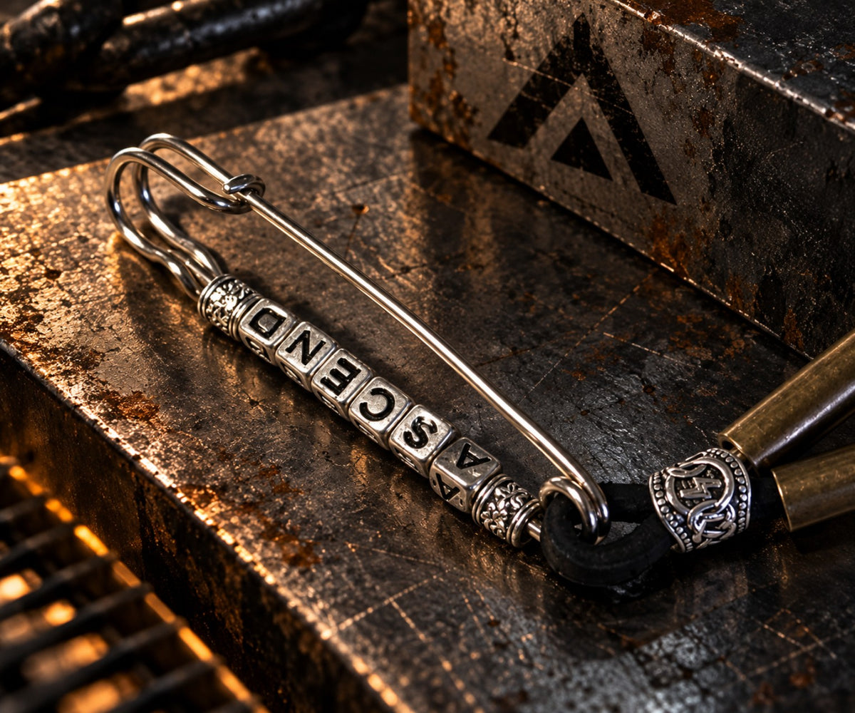 The Ascent Artifact Prototype 002 ASCEND letter and safety pin detail
