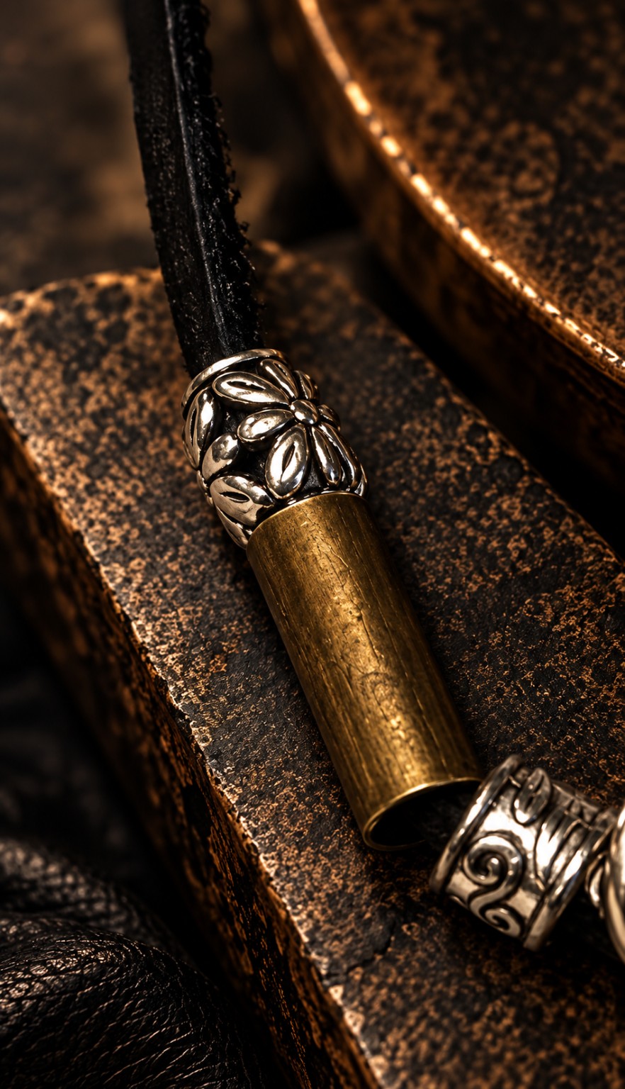 Brass antique silver and black leather material detail